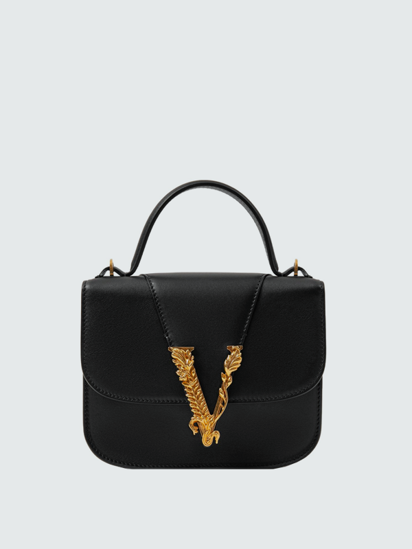 Необычная форма, яркий принт и экзотическая кожа: 15 сумок на весну и лето (фото 9)