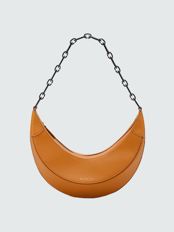 Необычная форма, яркий принт и экзотическая кожа: 15 сумок на весну и лето (фото 5)