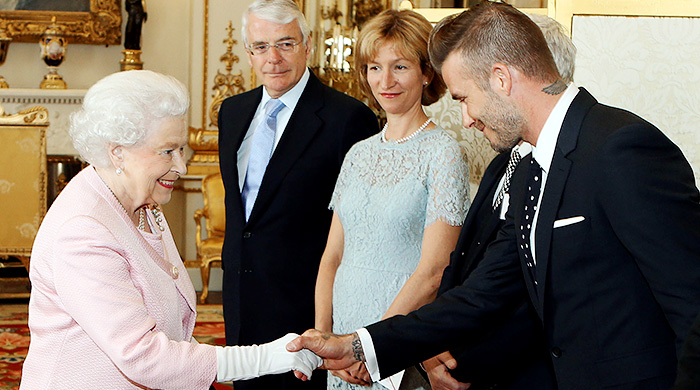 Дэвид Бекхэм на приеме в Букингемском дворце